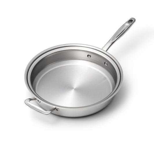 Stainless steel frying pan on a white background