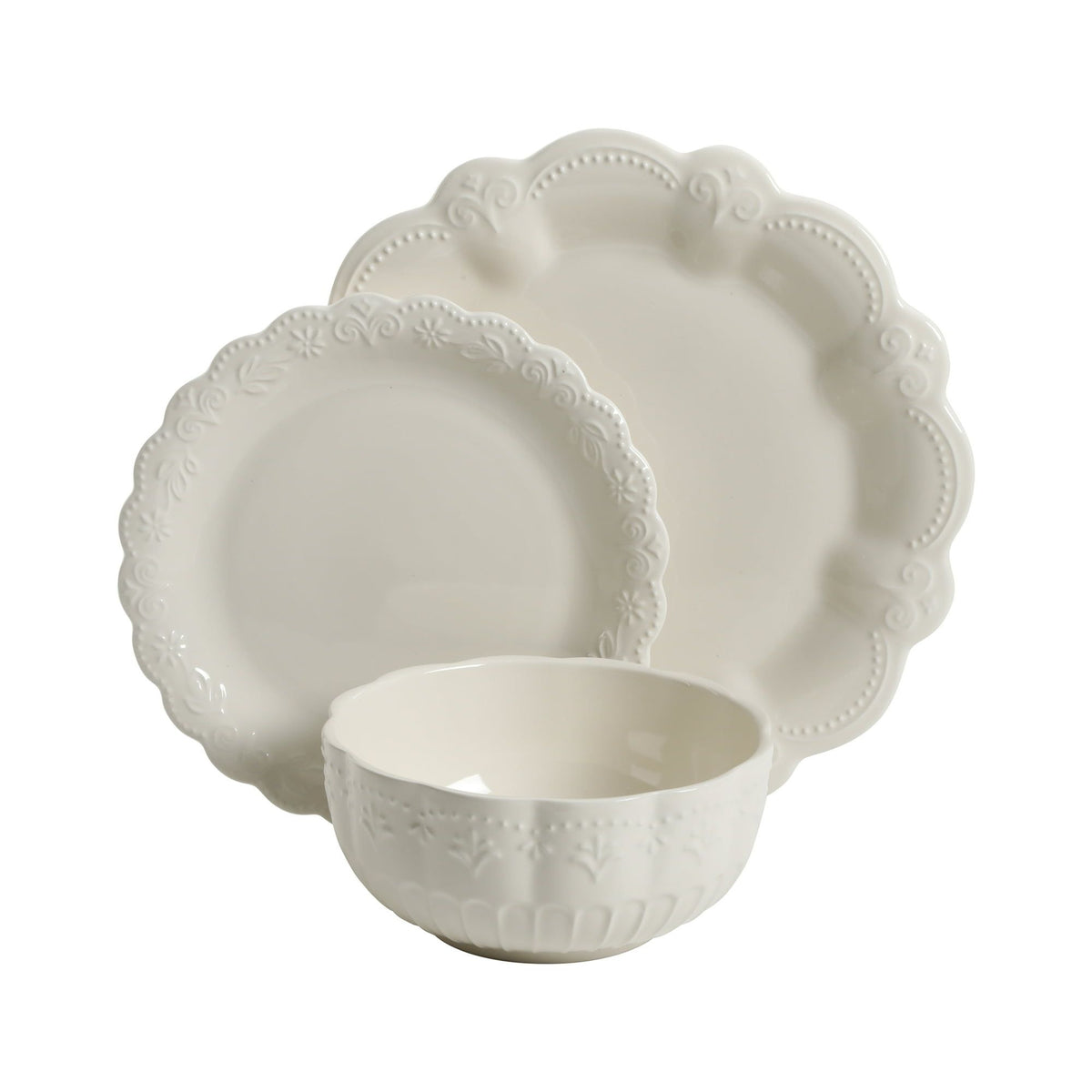 Set of white ceramic plates and bowl with decorative edge on a white background