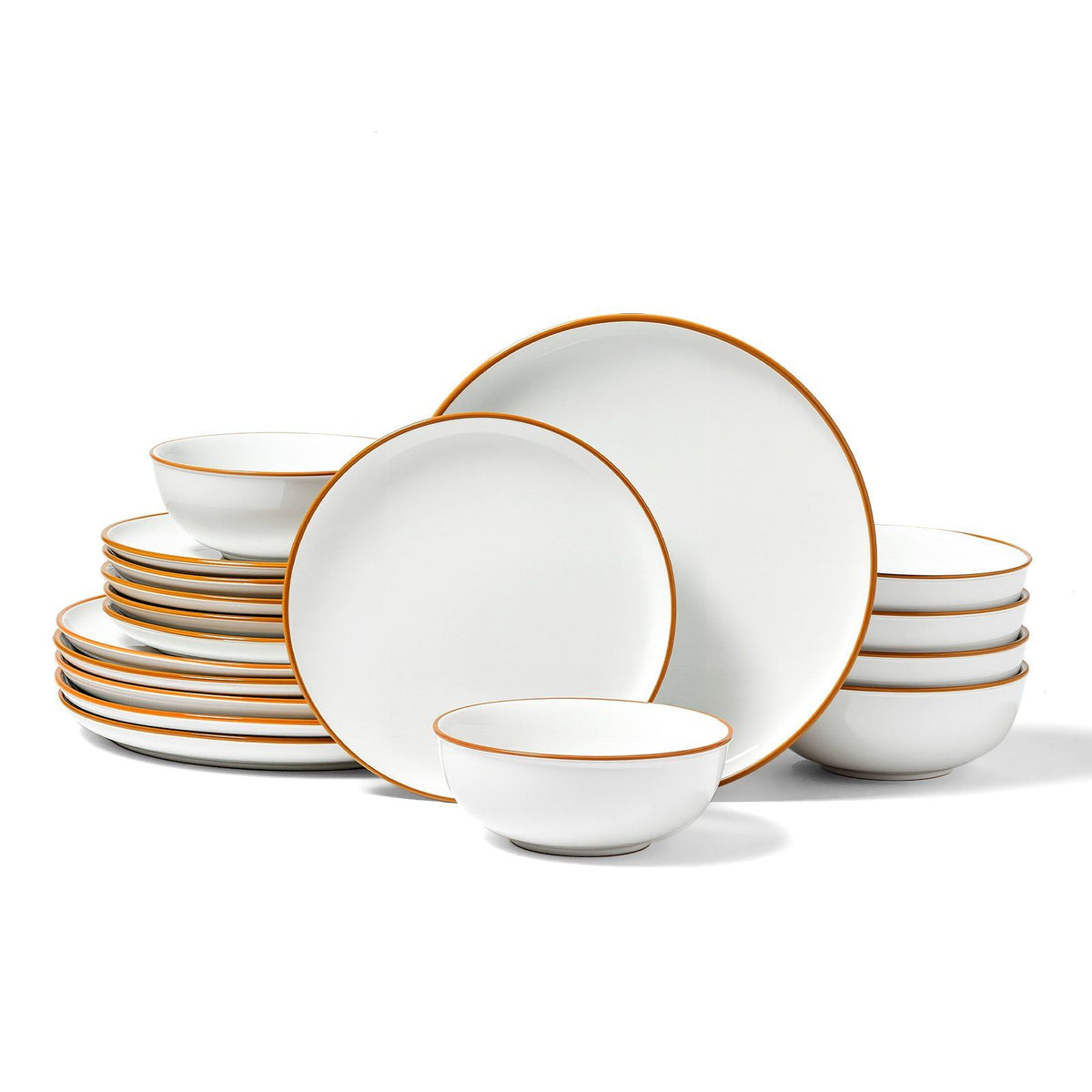 Set of white dinnerware with gold rims on a white background