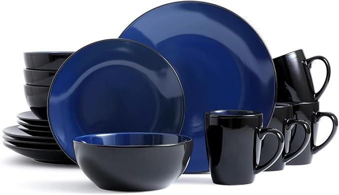 Set of blue and black dinnerware including plates, bowls, and mugs on a white background