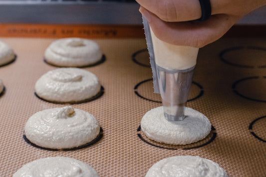 person holding clear plastic cup with white powder