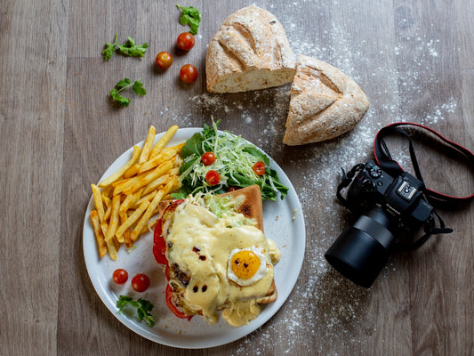 Hearty meal with fries, salad, and a camera
