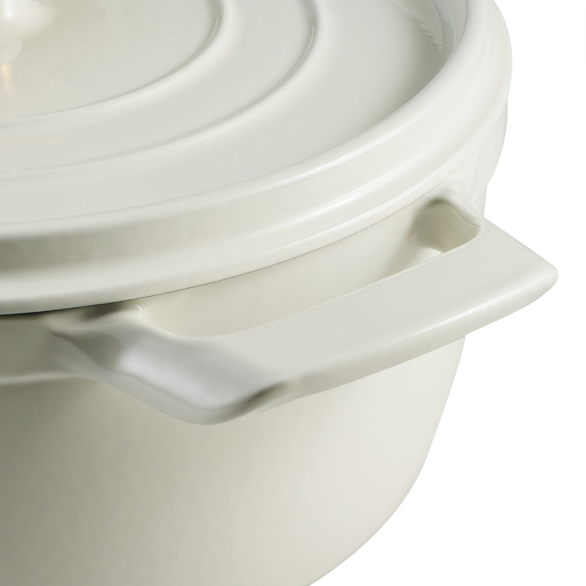 Close-up of a white ceramic pot with lid on a white background