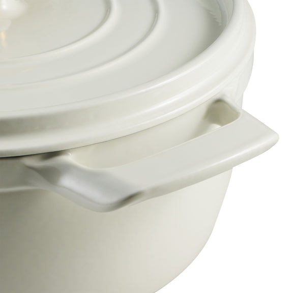 Close-up of a white ceramic pot with lid on a white background