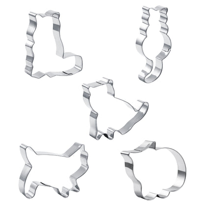 Set of five metal cookie cutters with various shapes on a white background