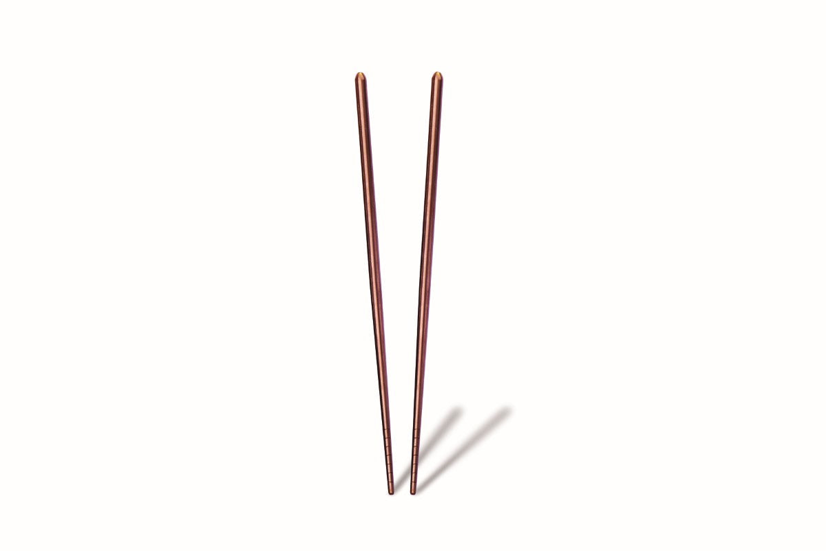 Two thin, metallic stakes on a white background
