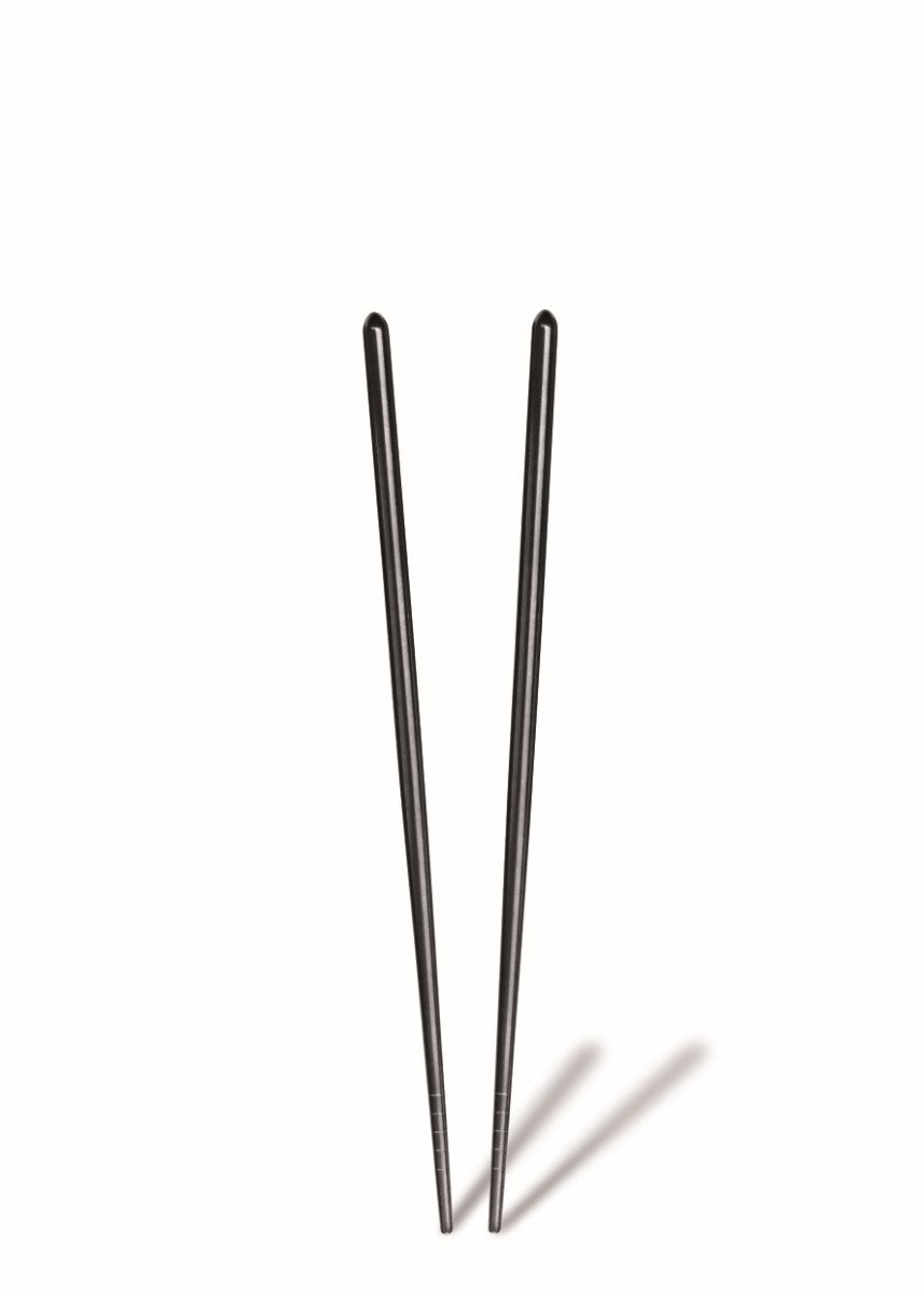 Two black chopsticks on a white background