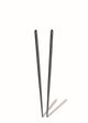 Two black chopsticks on a white background