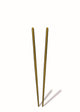 Pair of gold chopsticks on a white background