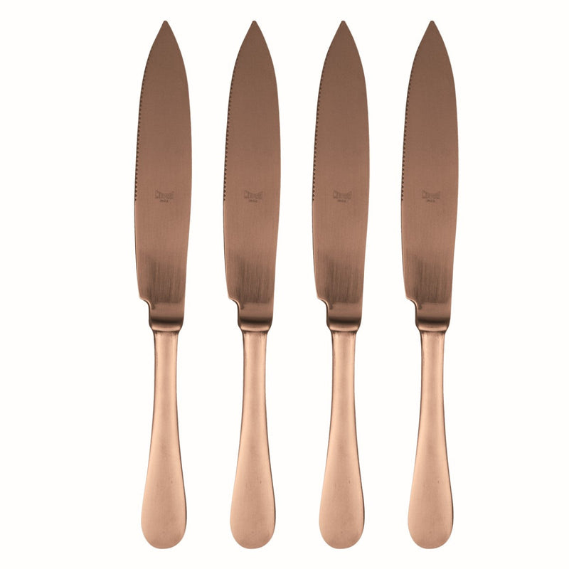 Four rose gold knives on a white background