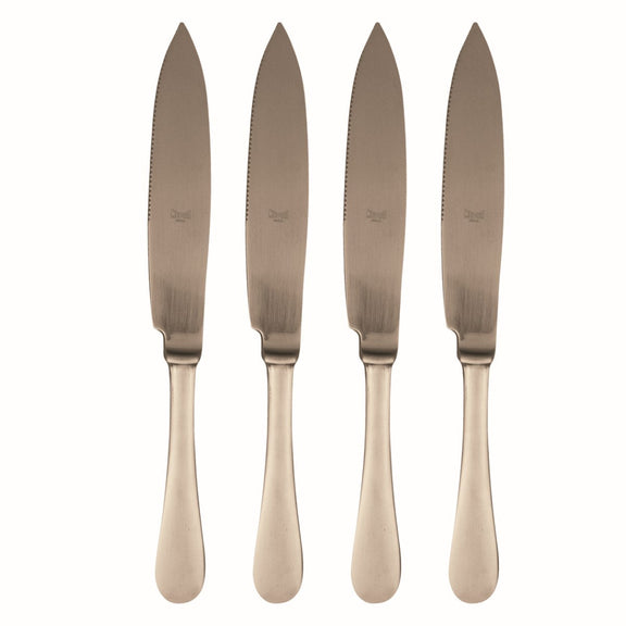 Four rose gold knives with a textured blade on a white background
