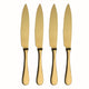 Four gold knives with serrated blades on a white background
