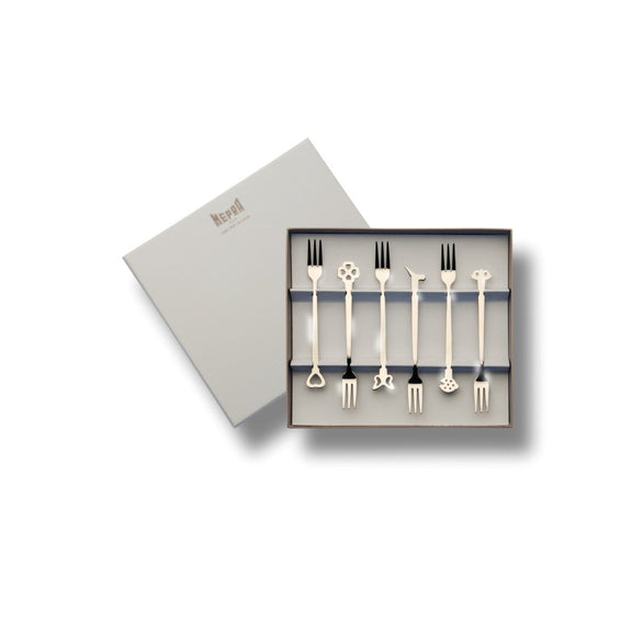 Set of decorative forks in a branded box on a white background