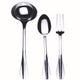 Set of silver spoons, ladle, and fork on a white background