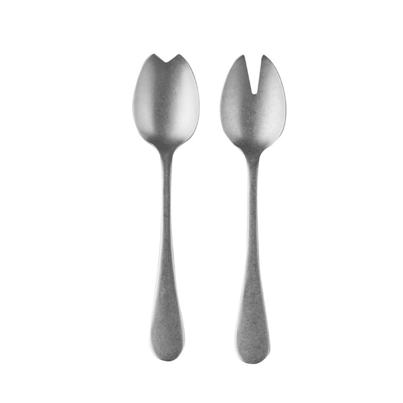 Two silver salad servers on a white background