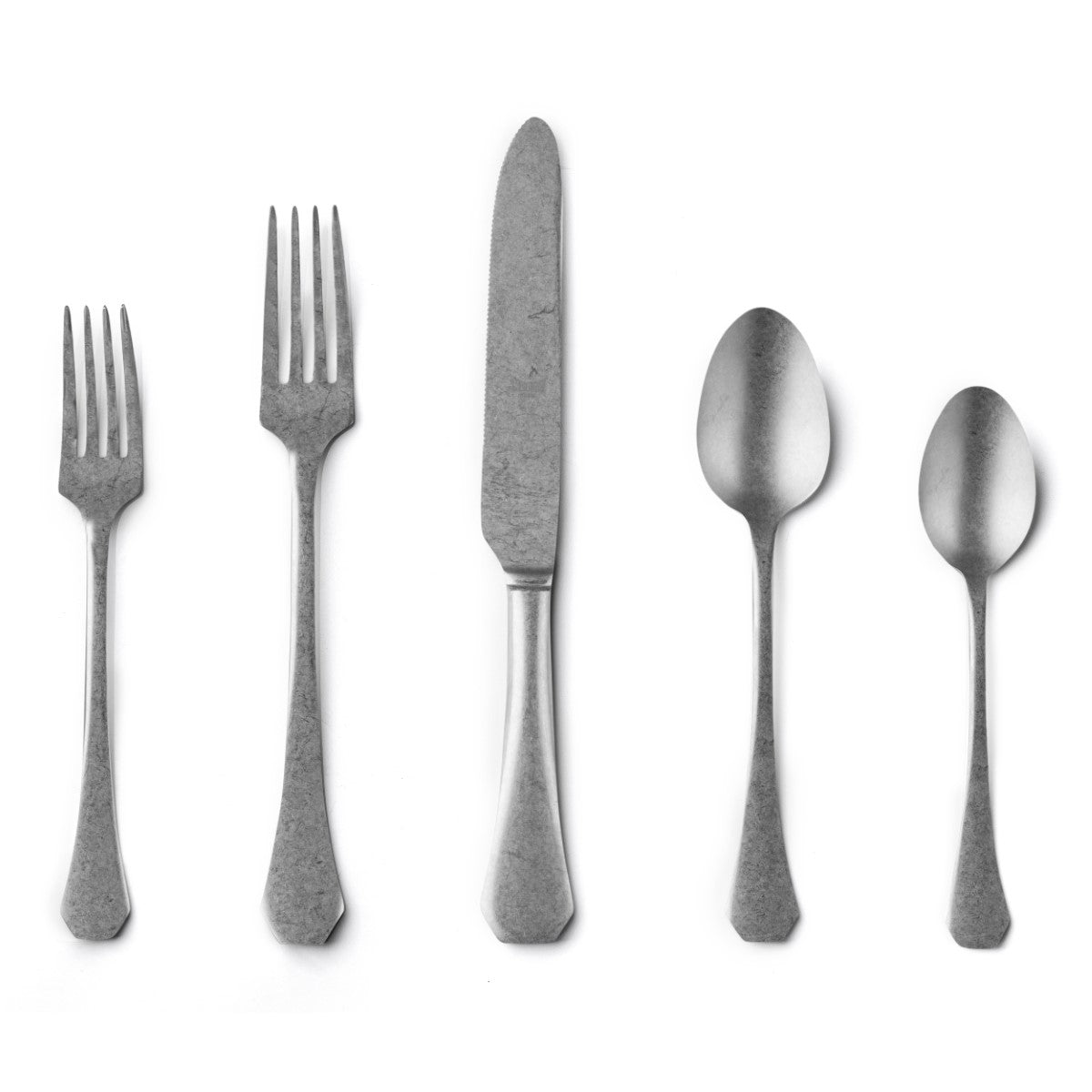 Set of silver cutlery including two forks, a knife, and two spoons on a white background.