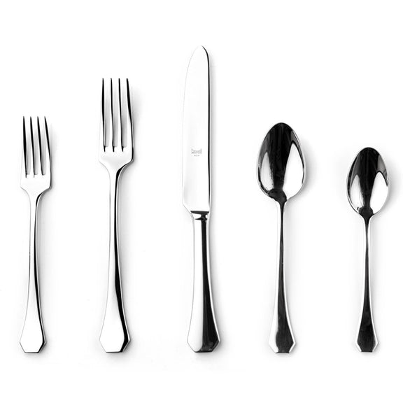 Set of silver cutlery including forks and spoons on a white background