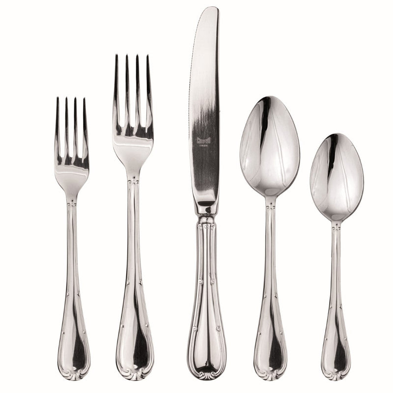 Set of silver cutlery including forks and spoons on a white background