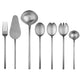 Set of silver cutlery including a fork, knife, ladle, and spoons on a white background
