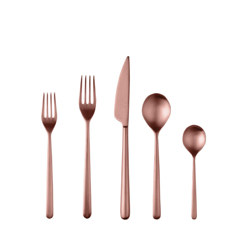 Set of rose gold cutlery including fork, knife, and spoons on a white background