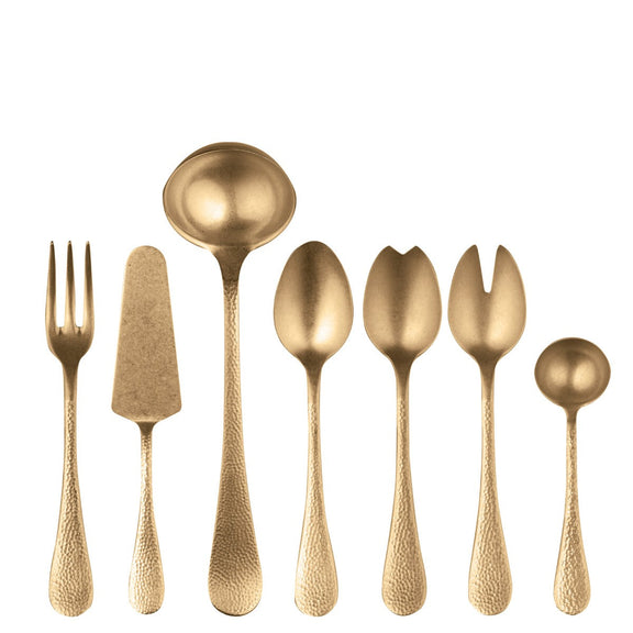 Set of gold flatware including fork, knife, and spoons on a white background