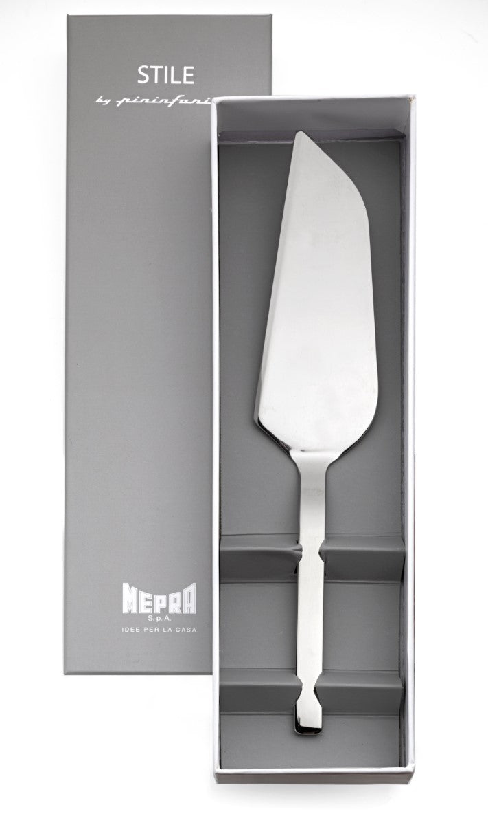 Stainless steel cake server in a gray box with 'STILE' branding.