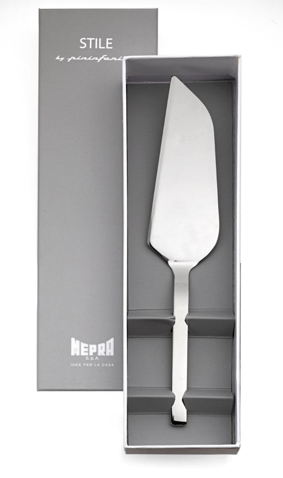 Stainless steel cake server in a gray box with 'STILE' branding.