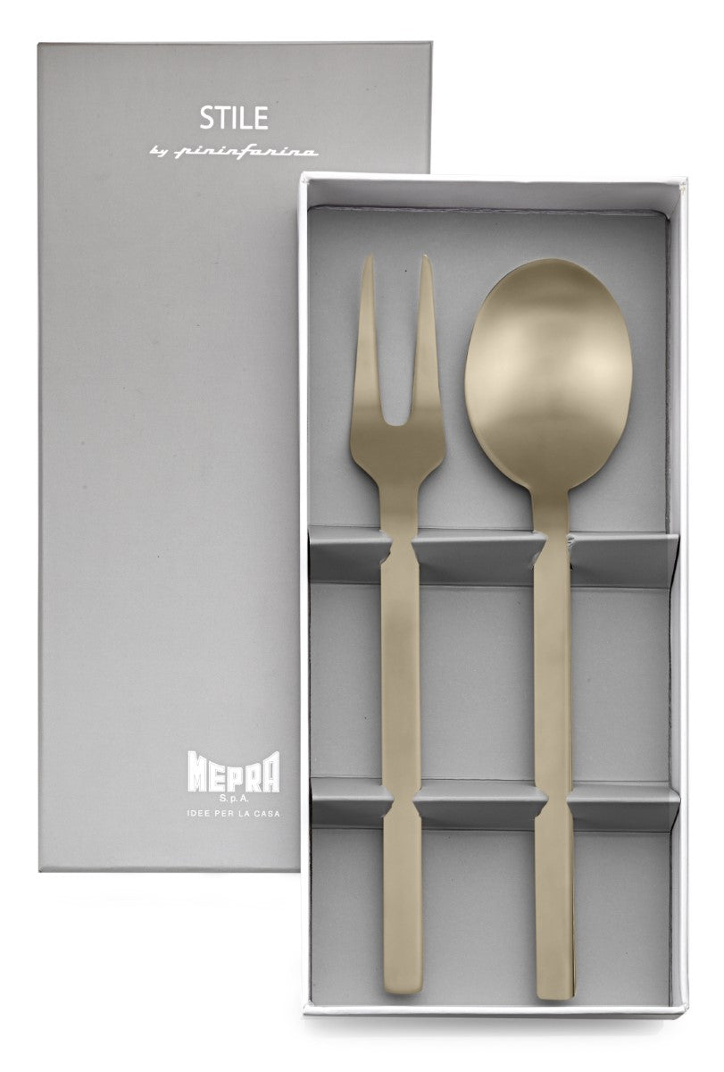 Gold spoon and fork set in a gray box with 'Mepra' branding.