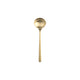 Gold spoon on a white background