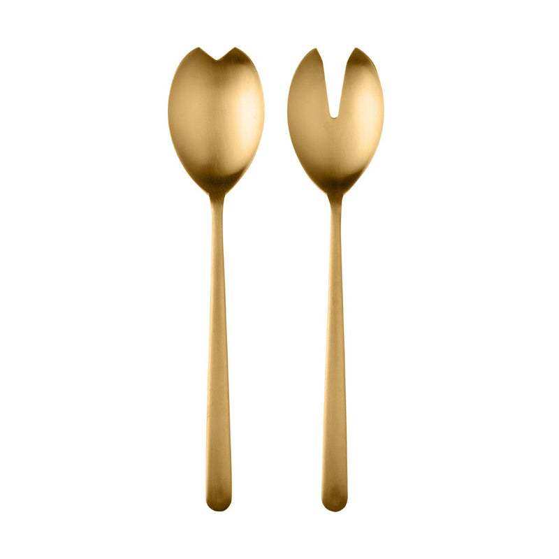 Two gold-colored salad servers on a white background
