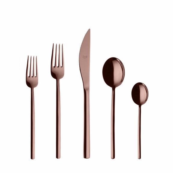 Set of rose gold cutlery including knife, fork, and spoons on a white background