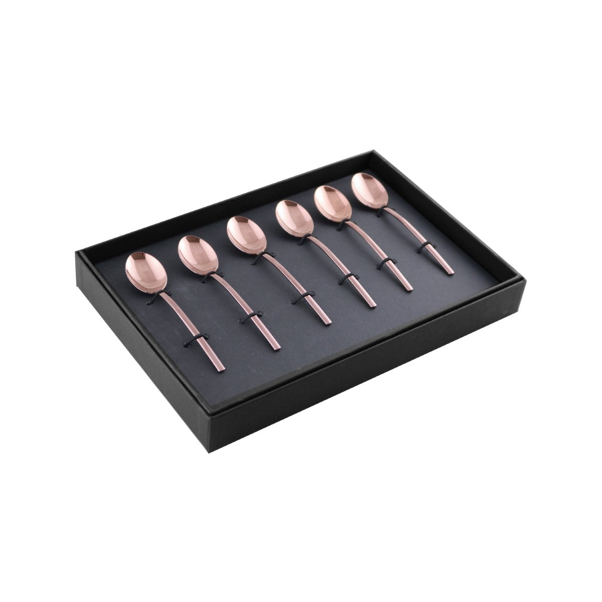 Set of rose gold spoons in a black box on a white background