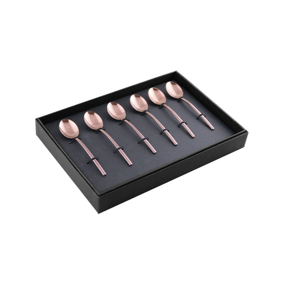 Set of rose gold spoons in a black box on a white background