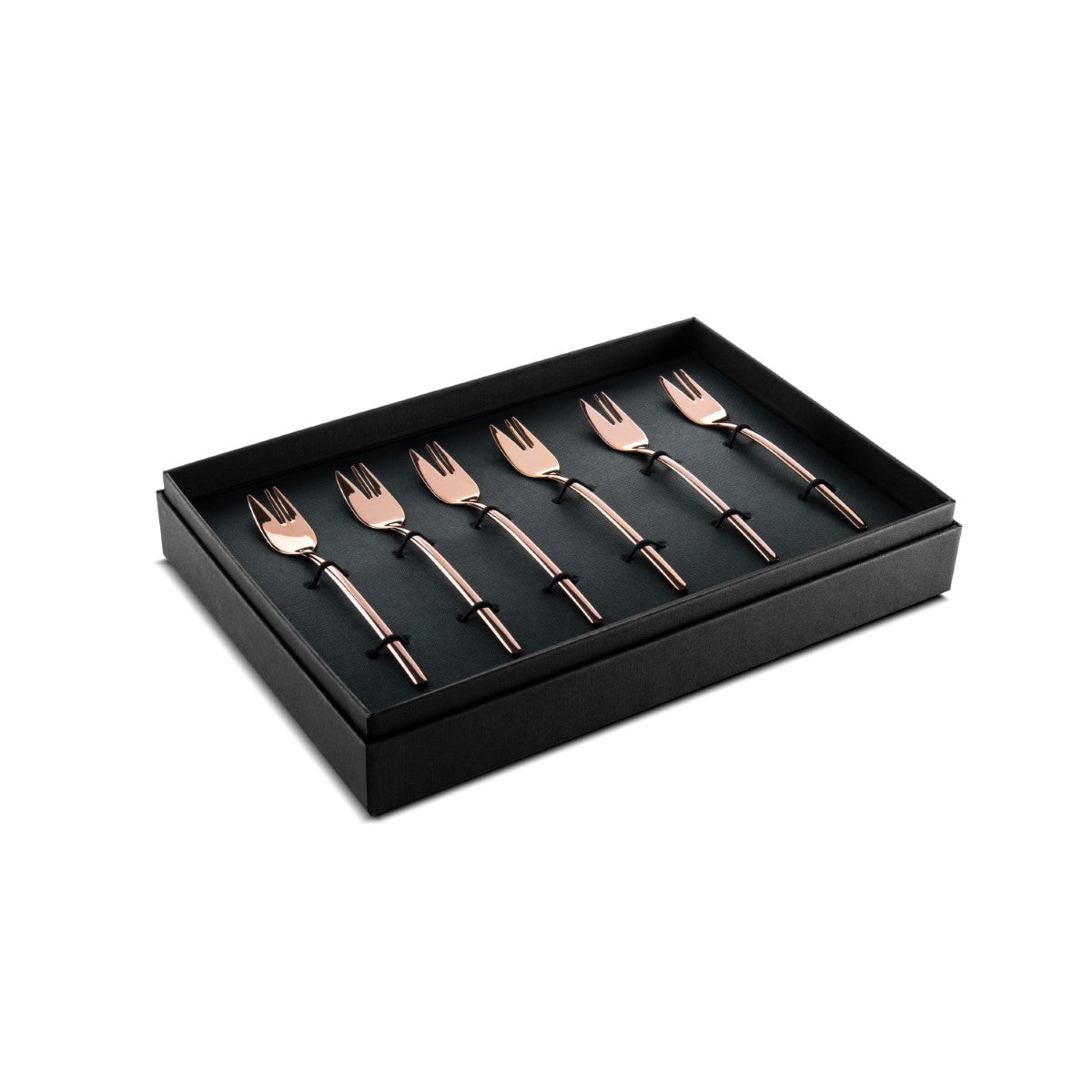 Set of rose gold forks in a black box on a white background