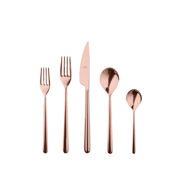 Rose gold cutlery set on a white background