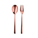 Rose gold spoon and fork set on a white background