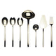 Set of black and gold cutlery on a white background
