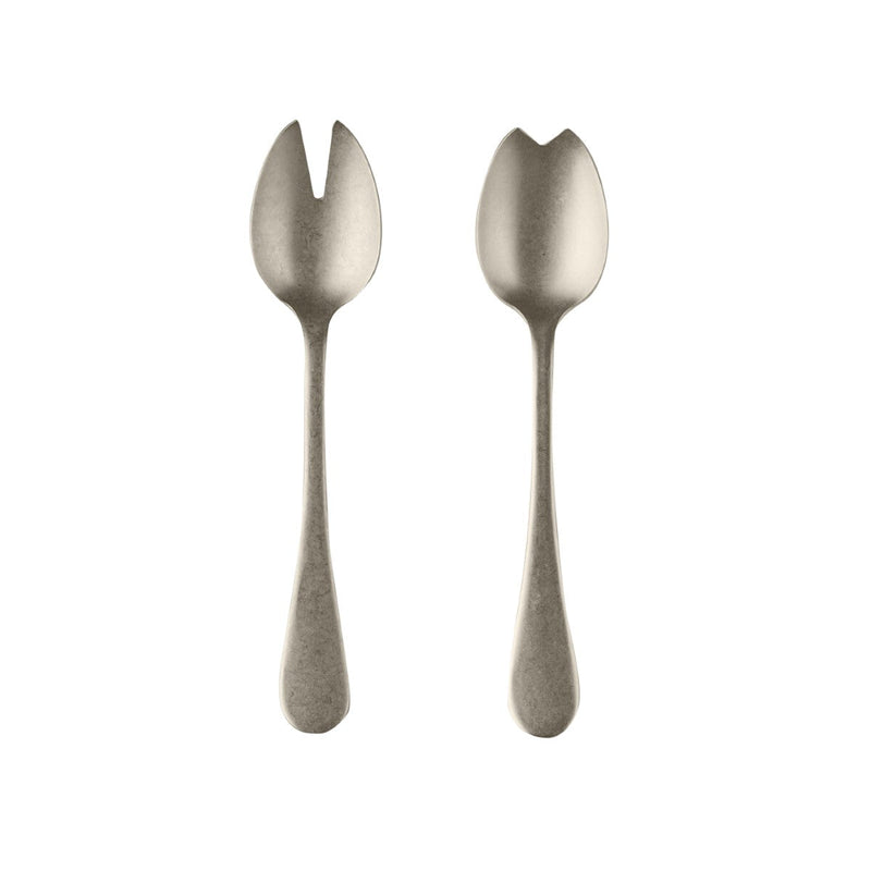 Two silver salad servers on a white background