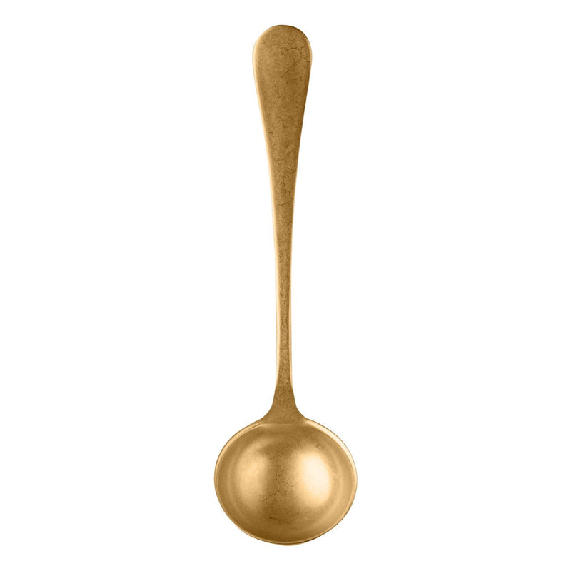 Gold spoon on a white background