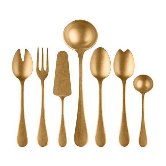 Set of gold-colored cutlery including spoons and a fork on a white background