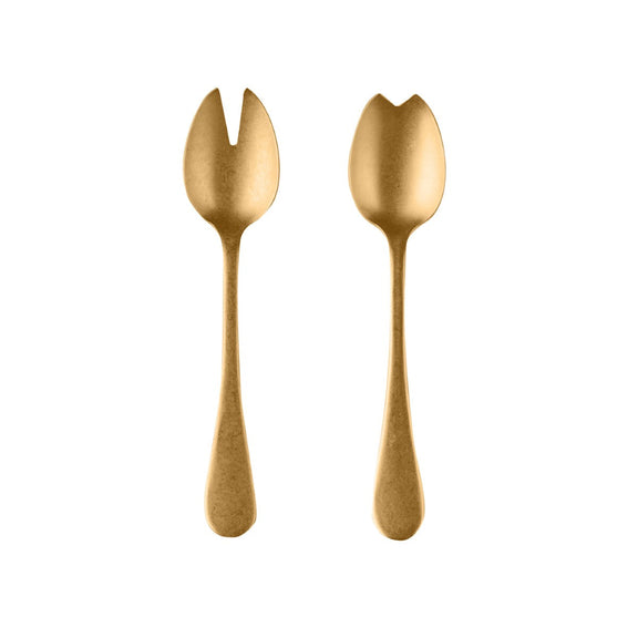 Two gold-colored salad servers on a white background