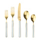 Set of gold cutlery with white handles on a white background