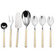 Set of silver cutlery with beige handles on a white background