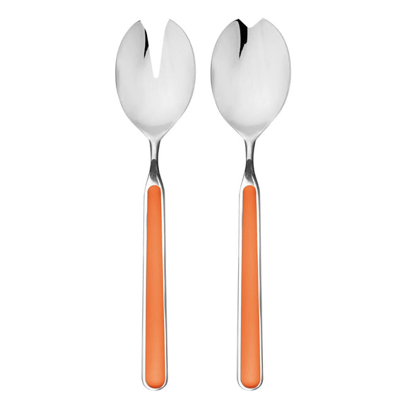 Two silver spoons with orange handles on a white background