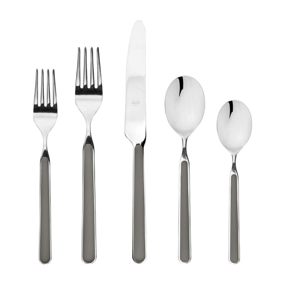 Set of silver cutlery including forks and spoons on a white background
