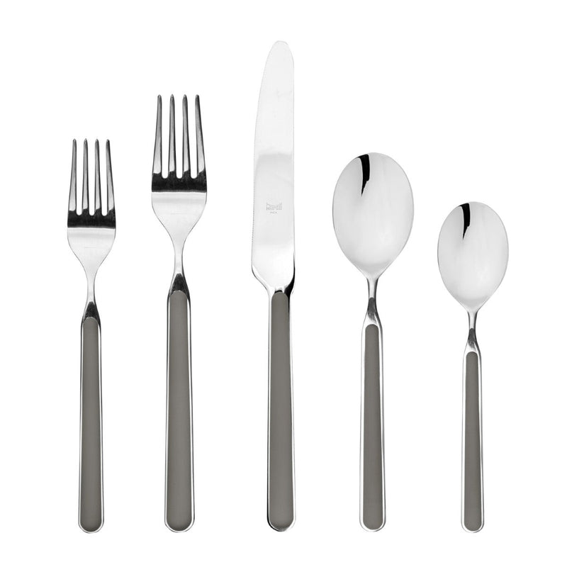 Set of silver cutlery including forks and spoons on a white background