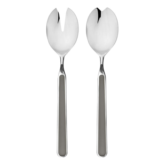 Two silver salad servers on a white background