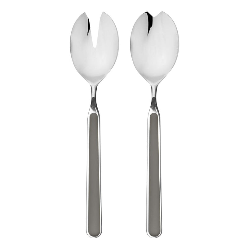 Two silver salad servers on a white background