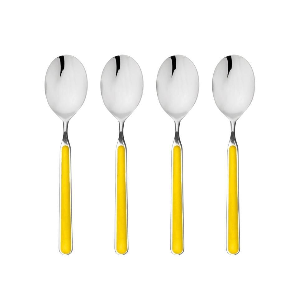 Four silver spoons with yellow handles on a white background