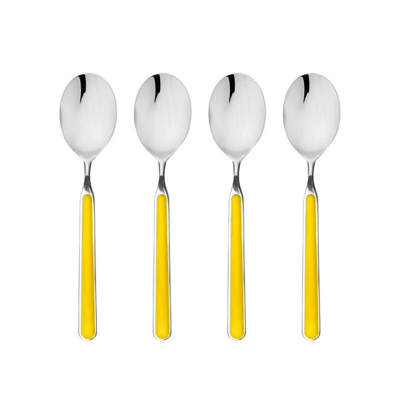 Four silver spoons with yellow handles on a white background
